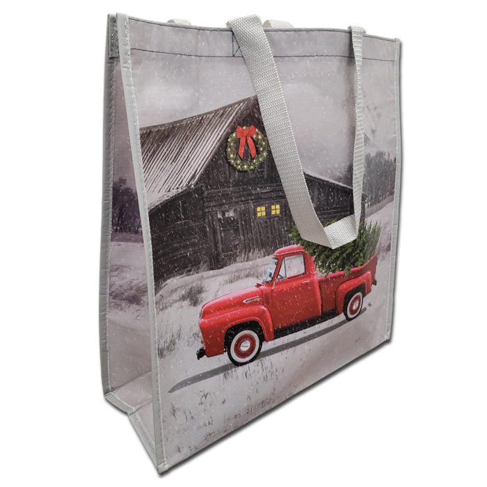 Bolsa de compras navideña con forma de camión rojo